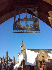 Signage above the archway as you enter Hogsmeade. 