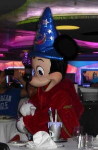 Sorcerer Mickey comes out in a parade with all the dining room staff