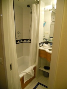 One side of the split bathroom has a tub and a sink.