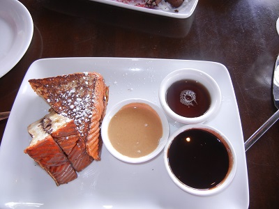 Chocolate milk-dipped haupia bread french toast with bananas and peanut butter