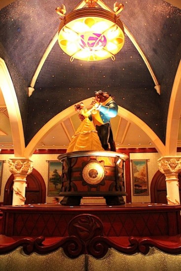 The Castle Gallery with Belle and the Beast centered in the room dancing