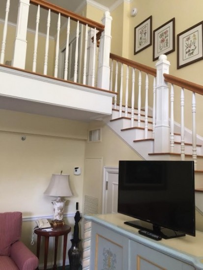 Living space with stairs to the Bedroom.