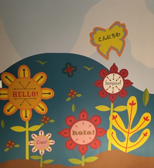 The murals like this one and throughout the nursery bring the theme of "it's a small world" from Disney's Theme Parks into this space.