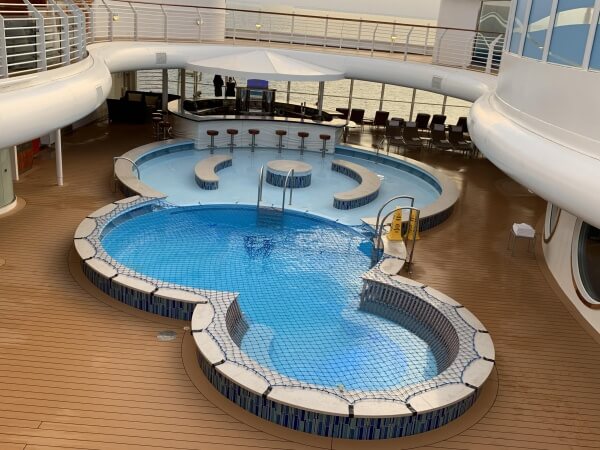 Quiet Cove Pool_DCL Enjoy a dip or a drink at the Quiet Cove Pool on the Disney Fantasy