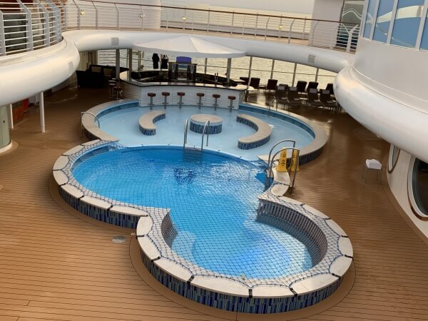 Enjoy a dip or a drink at the Quiet Cove Pool on the Disney Fantasy