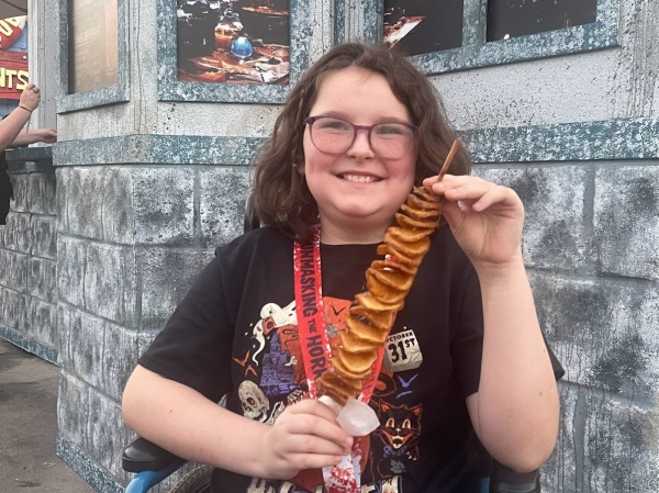 Twisted Tater Girl holding a Twisted Tater