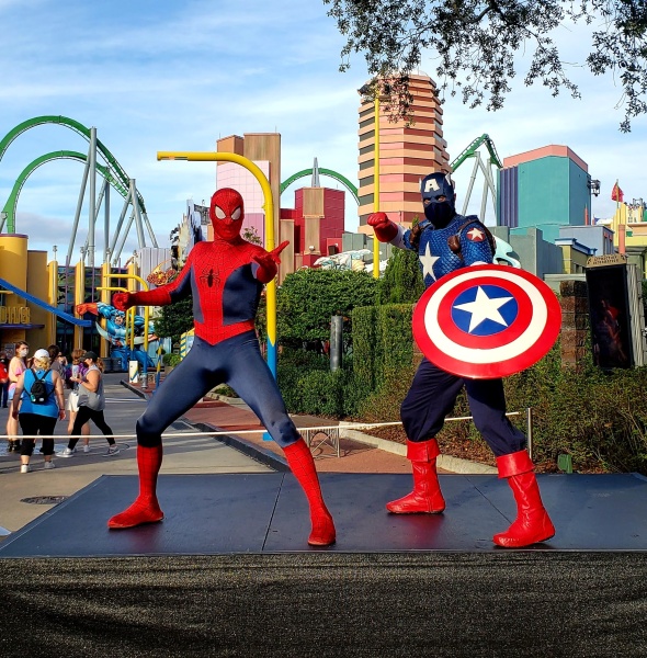 Spider-Man and Captain America pose on a stage at Universal Islands of Adventure