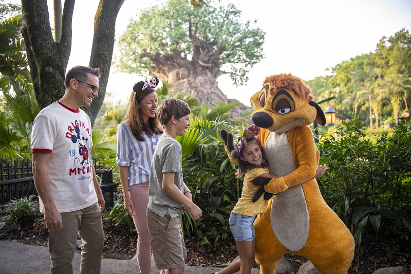 Timon with guests at Disney's Animal Kingdom - Join our 2026 Walt Disney World Vacation Wait List