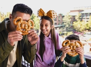 Disney Grand Californian-Hotel Guests on Balcony with Mickey Pretzels