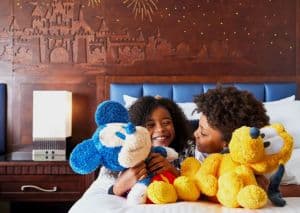 Disneyland Hotel Children with plush Disney characters.